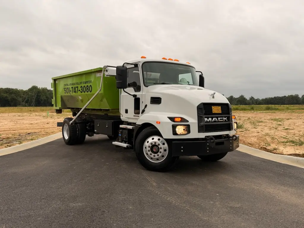 Central Arkansas Rolloff Dumpsters team delivering a roll-off dumpster